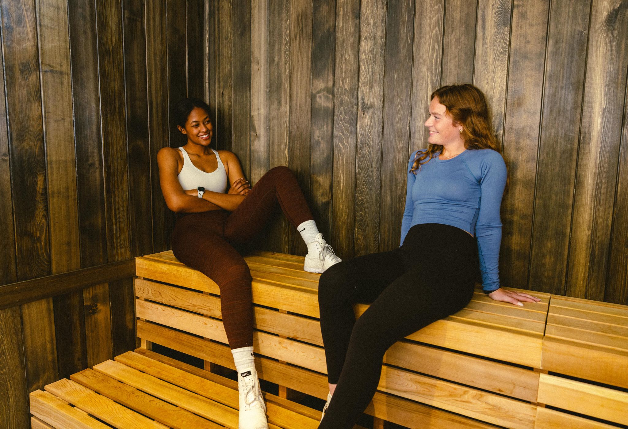 two people sitting and reading books