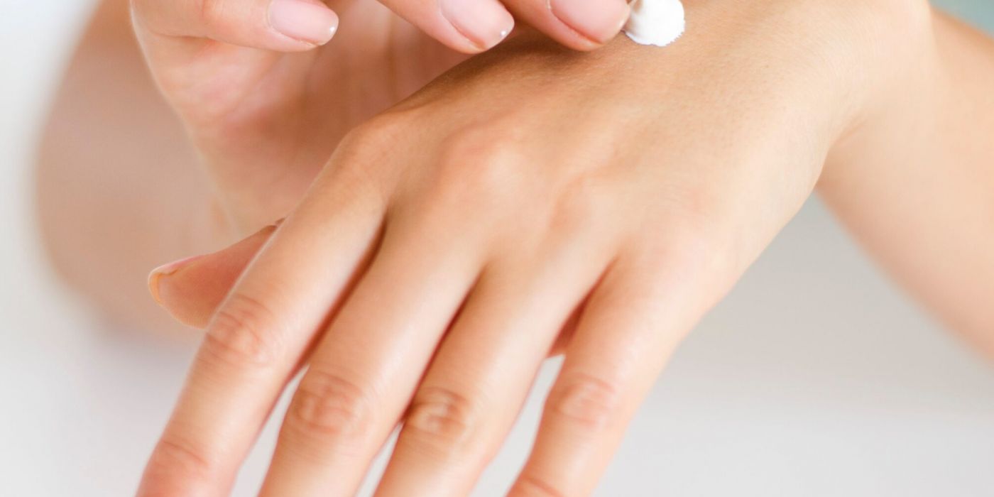 College student putting lotion on for a self-care tip