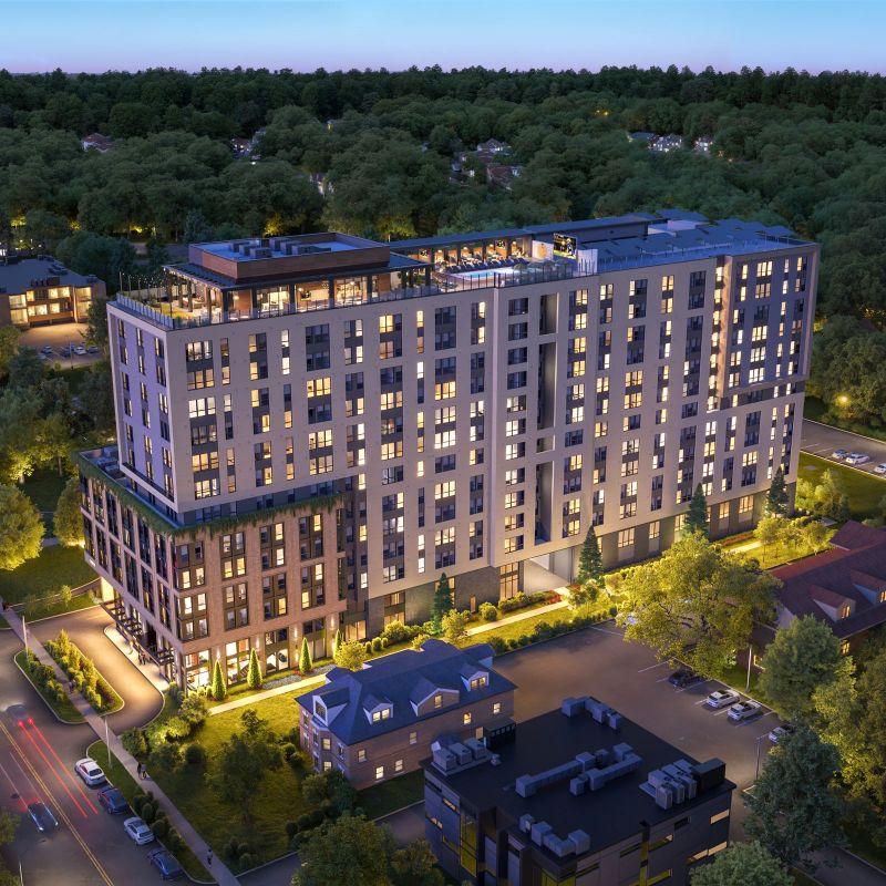 VERVE Ann Arbor student apartments shown in birds-eye view, with surrounding greenery and Ann Arbor neighborhood